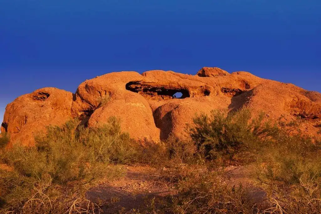 Hole-in-the-Rock in Papago Park glowing orange at sunset