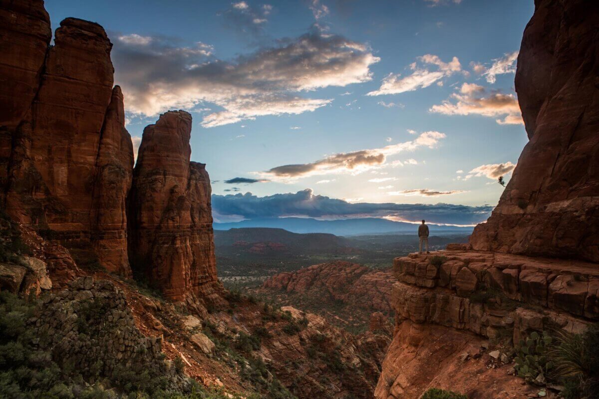 A lone hiker at the Cathedral Rock saddle above Sedona